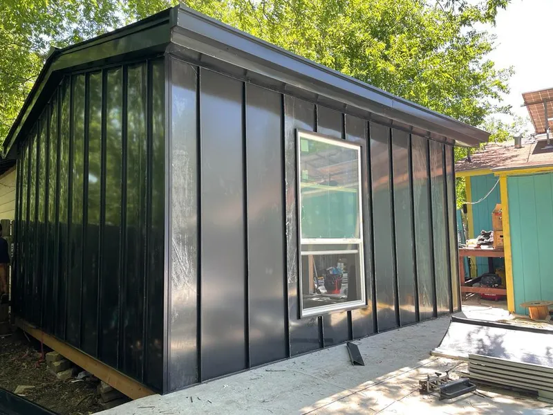 Black standing seam metal wall panels for Roof Inspection in Cody